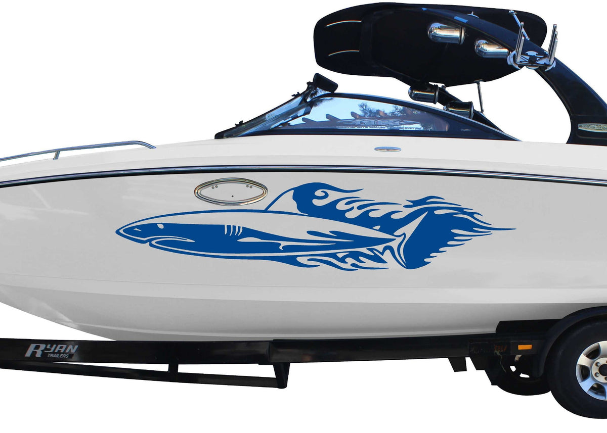 white boat with blue shark flames vinyl graphics on port side