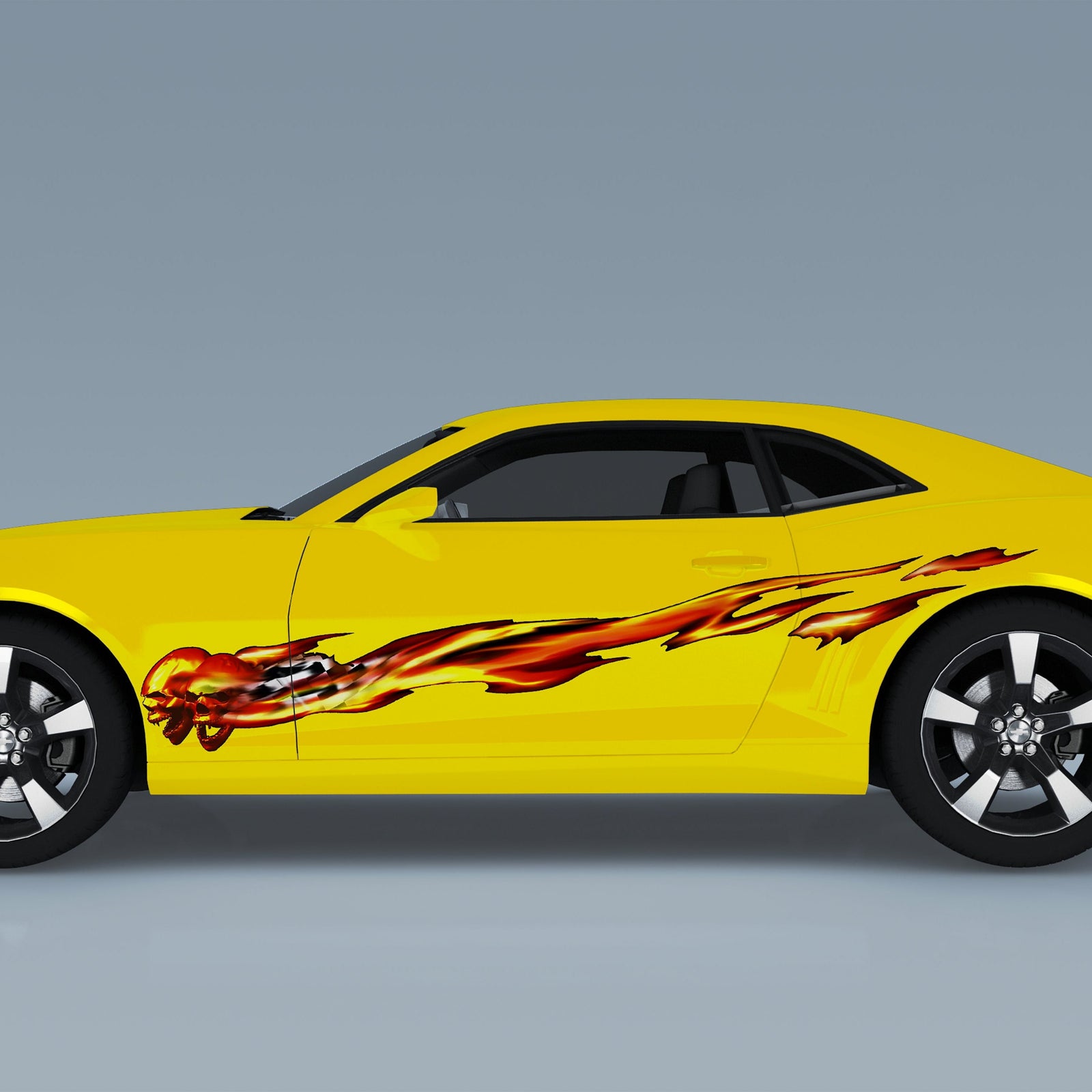 yellow camaro sports car with ghost flames graphic decal on the side