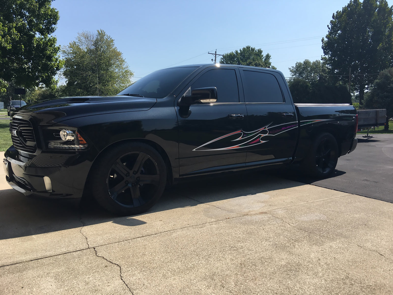 Blade multi color stripe on black pickup truck
