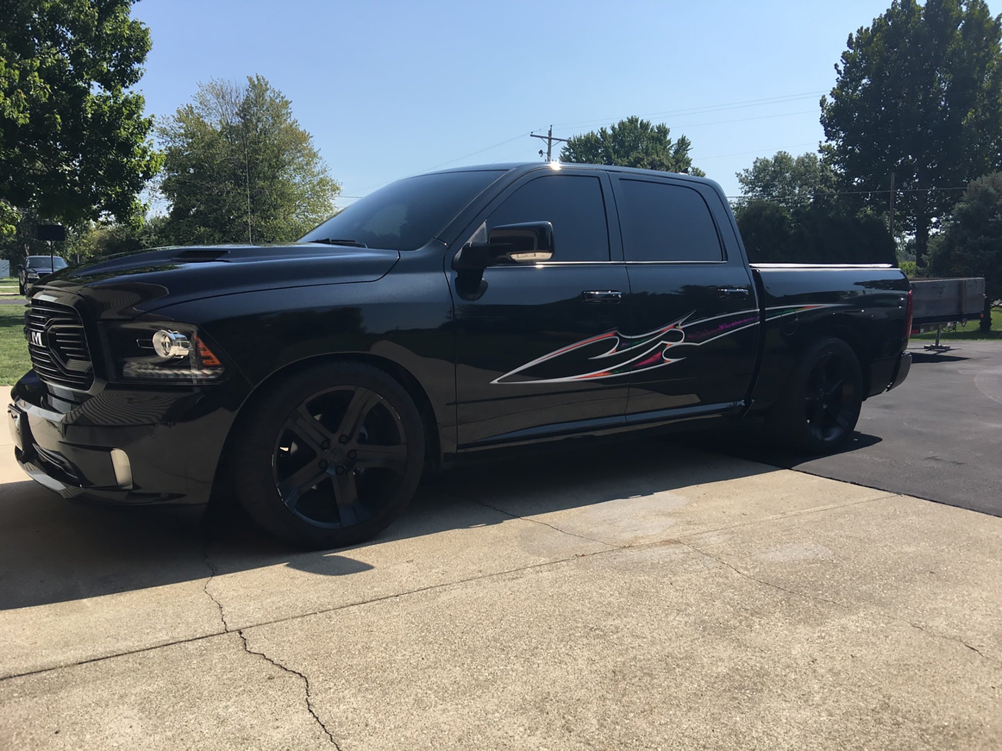 Blade multi color stripe on black pickup truck