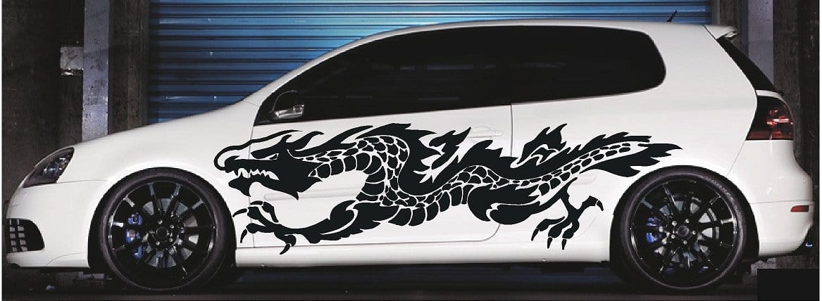 white SUV with black flaming dragon vinyl cut decal on driver side