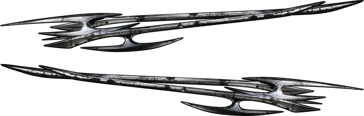 Pair of chrome tribal edge vinyl decals for cars and trucks, long spiked metal blades shown as mirrored driver and passenger side graphics on white background.