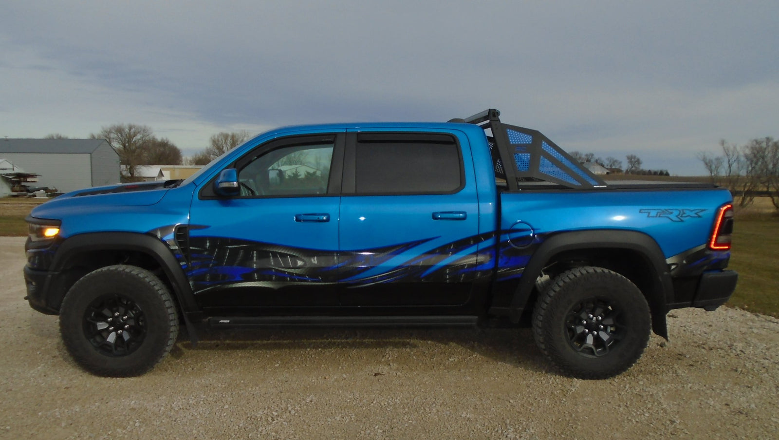 carbon fiber wave half wrap on blue truck
