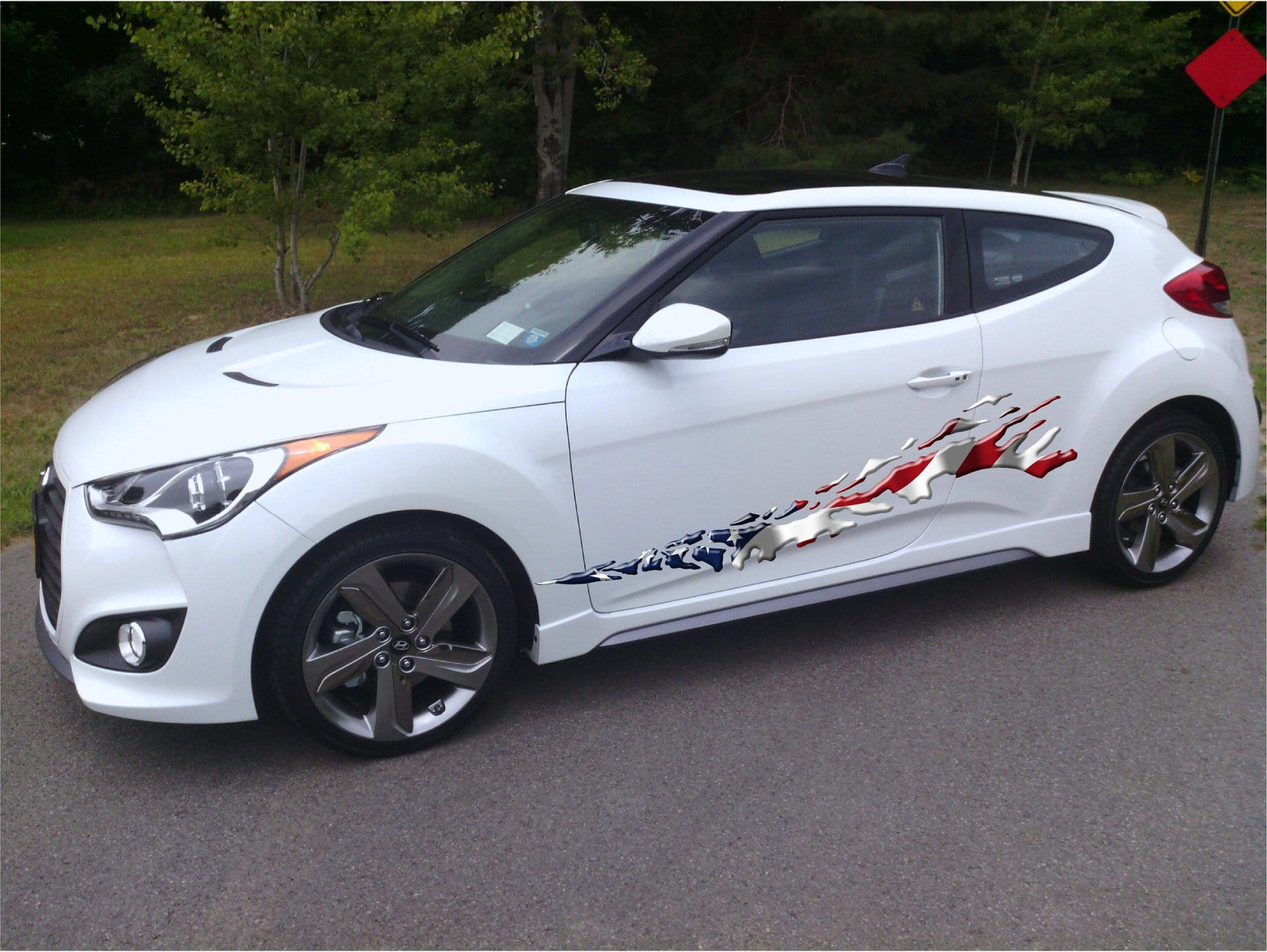 american flag mud splash graphics on side of white truck