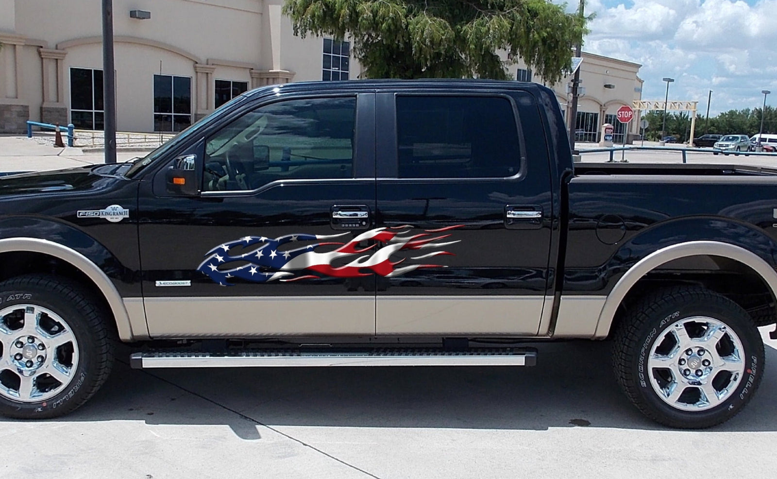 american flag flames vinyl graphics on the side of white truck