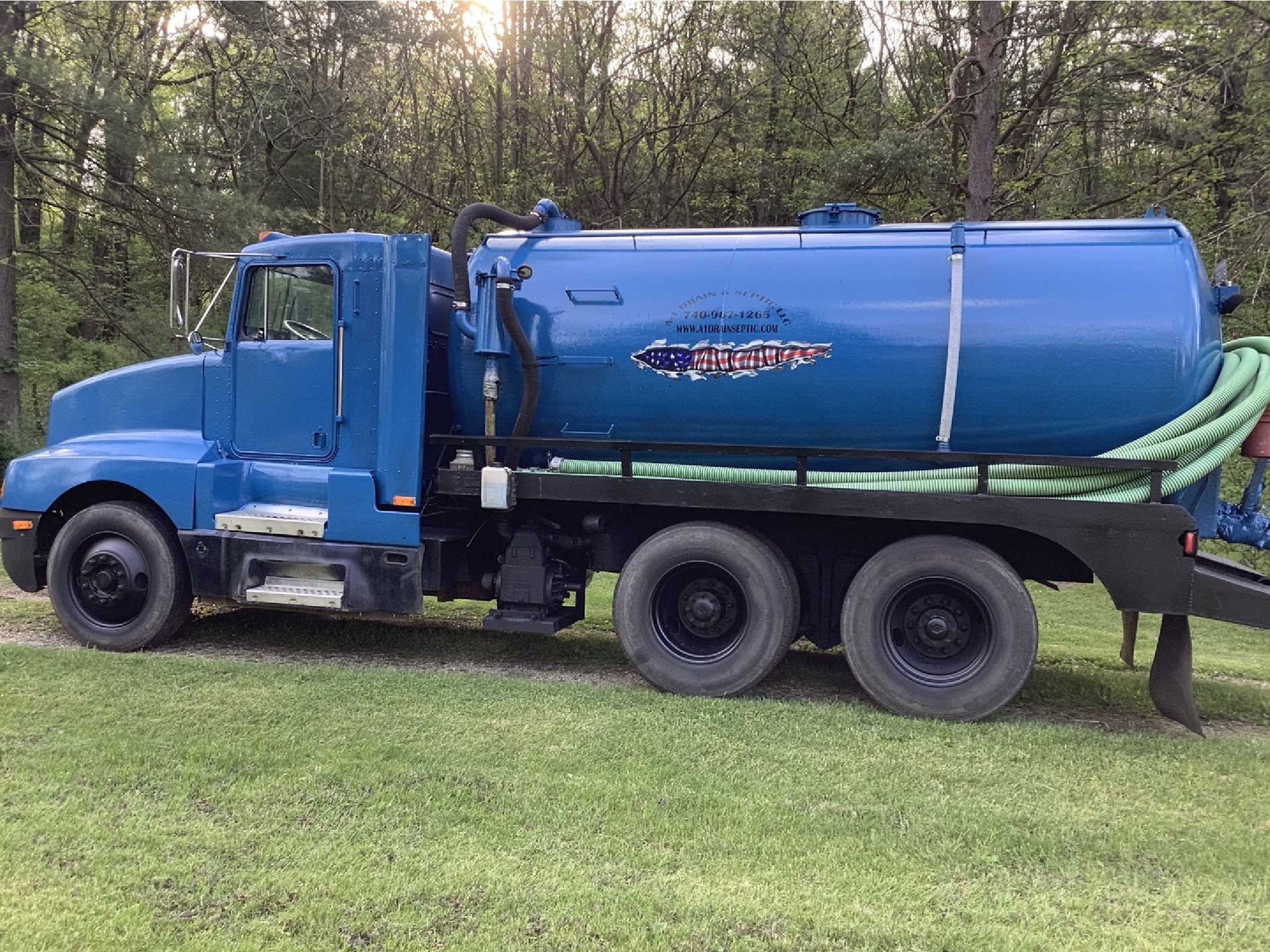 american flag tear vinyl graphics on the side of white truck