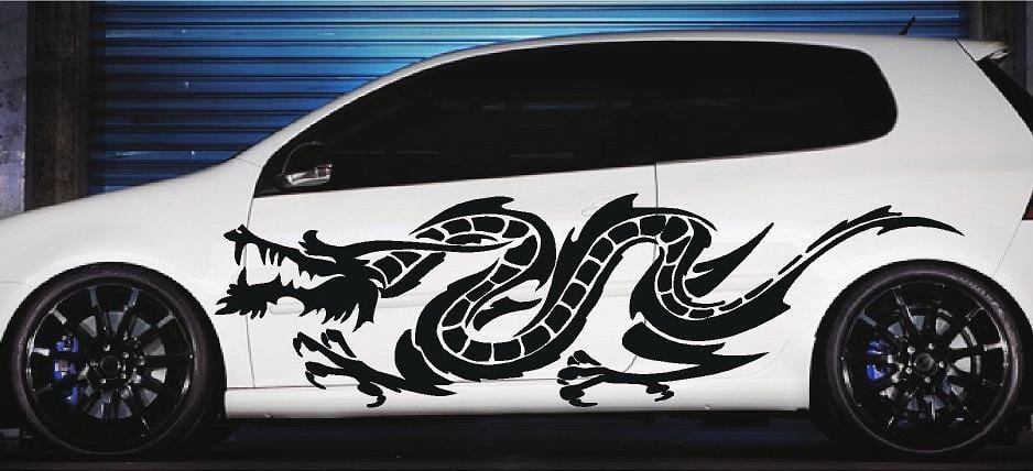 White car with black asian dragon decal on driver side