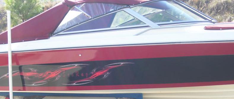 tribal links vinyl decals on the side of white boat