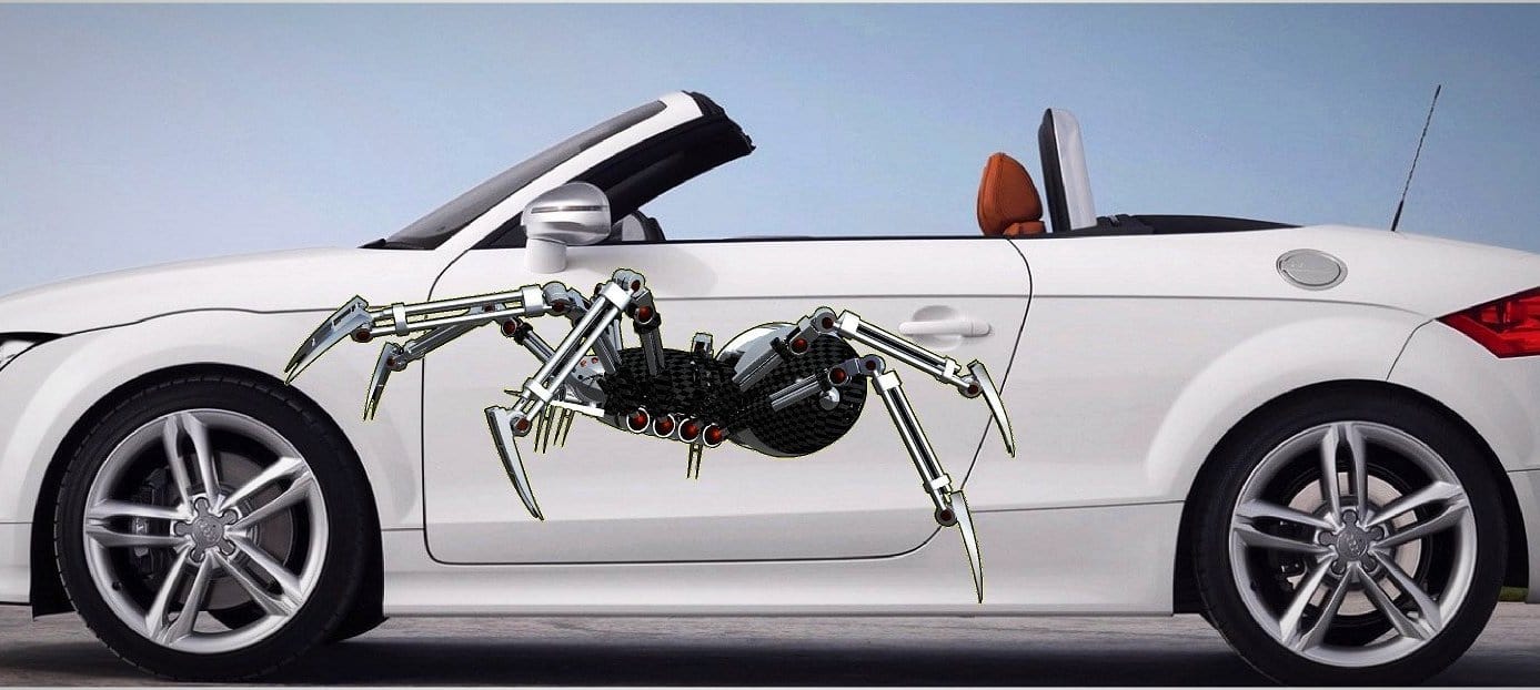 Robot spider decals on the side of red vw beetle car