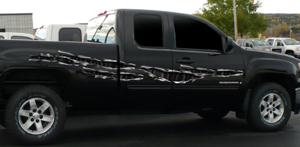 carbon fiber tears vinyl graphics on black pickup