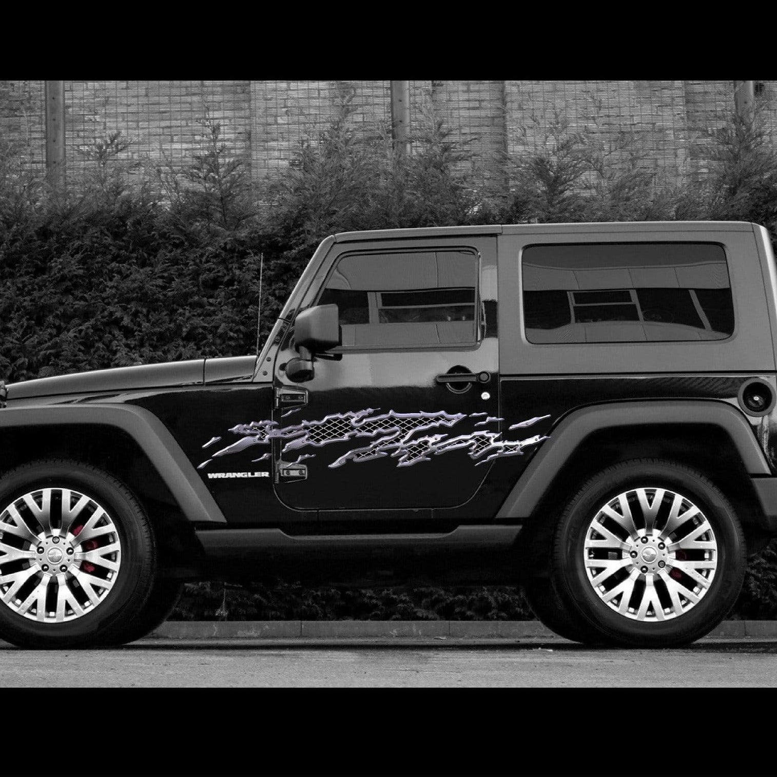 metal mud splash vinyl graphics on the side of black suv