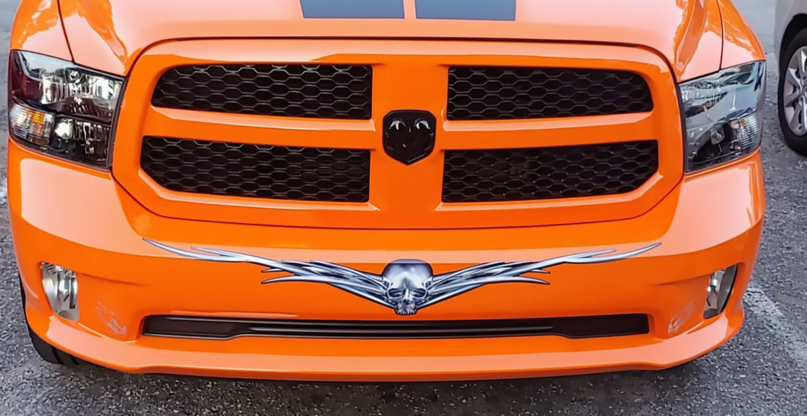 chrome horned skull vinyl decal on dodge ram front bumper