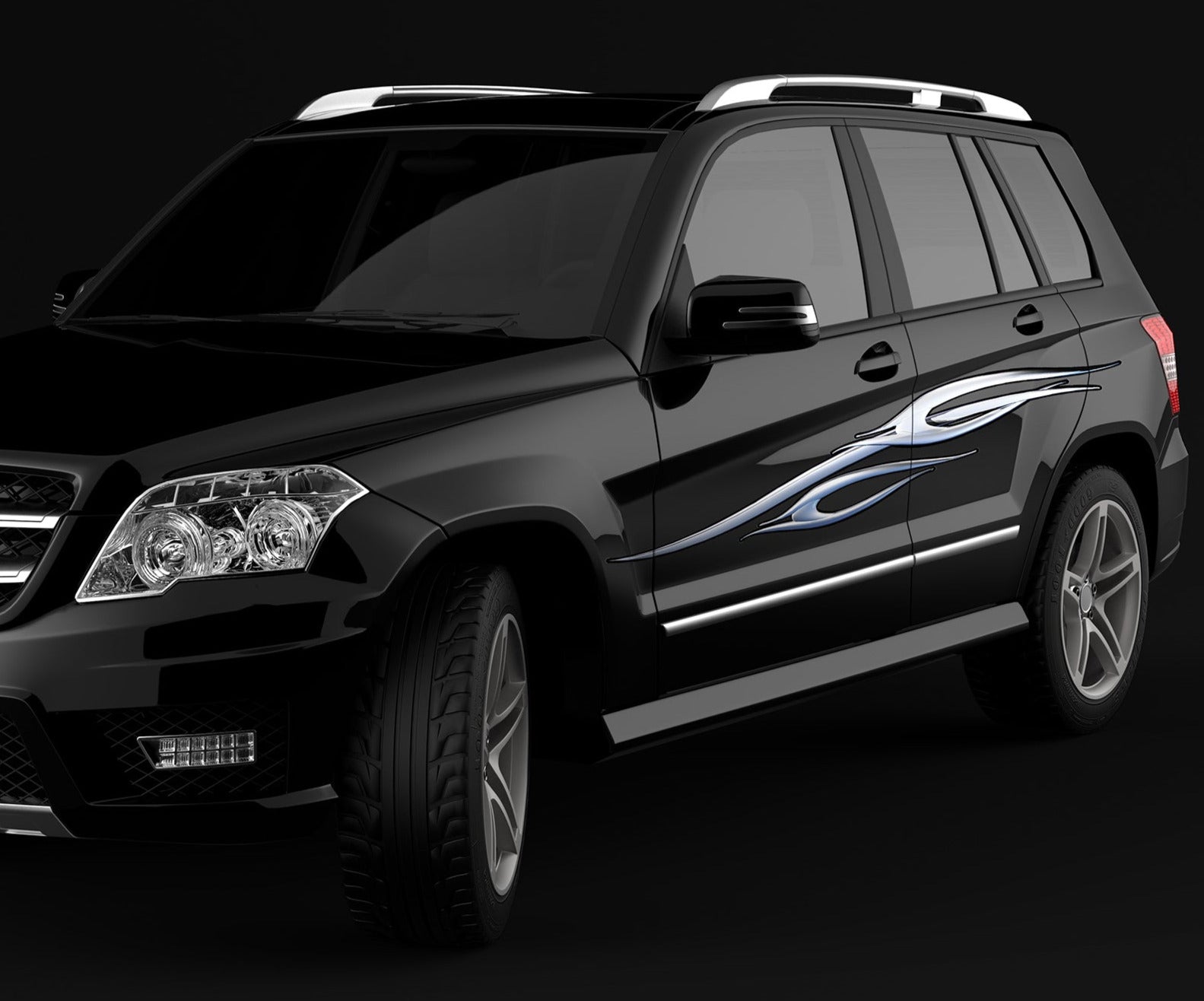 chrome spear decals on the side of blue S10 Chevy blazer