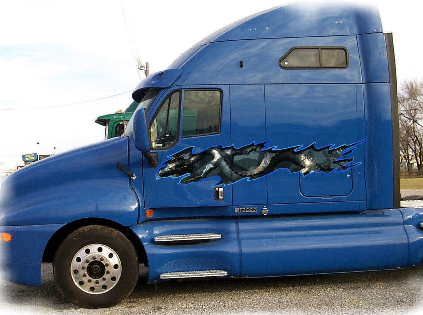 asian dragon graphics on the side of white truck