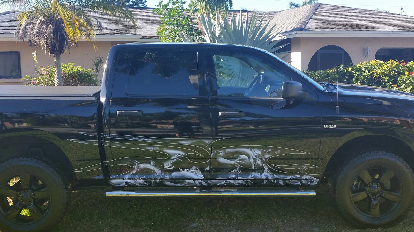 sports car with dragon attack half wrap on its driver side