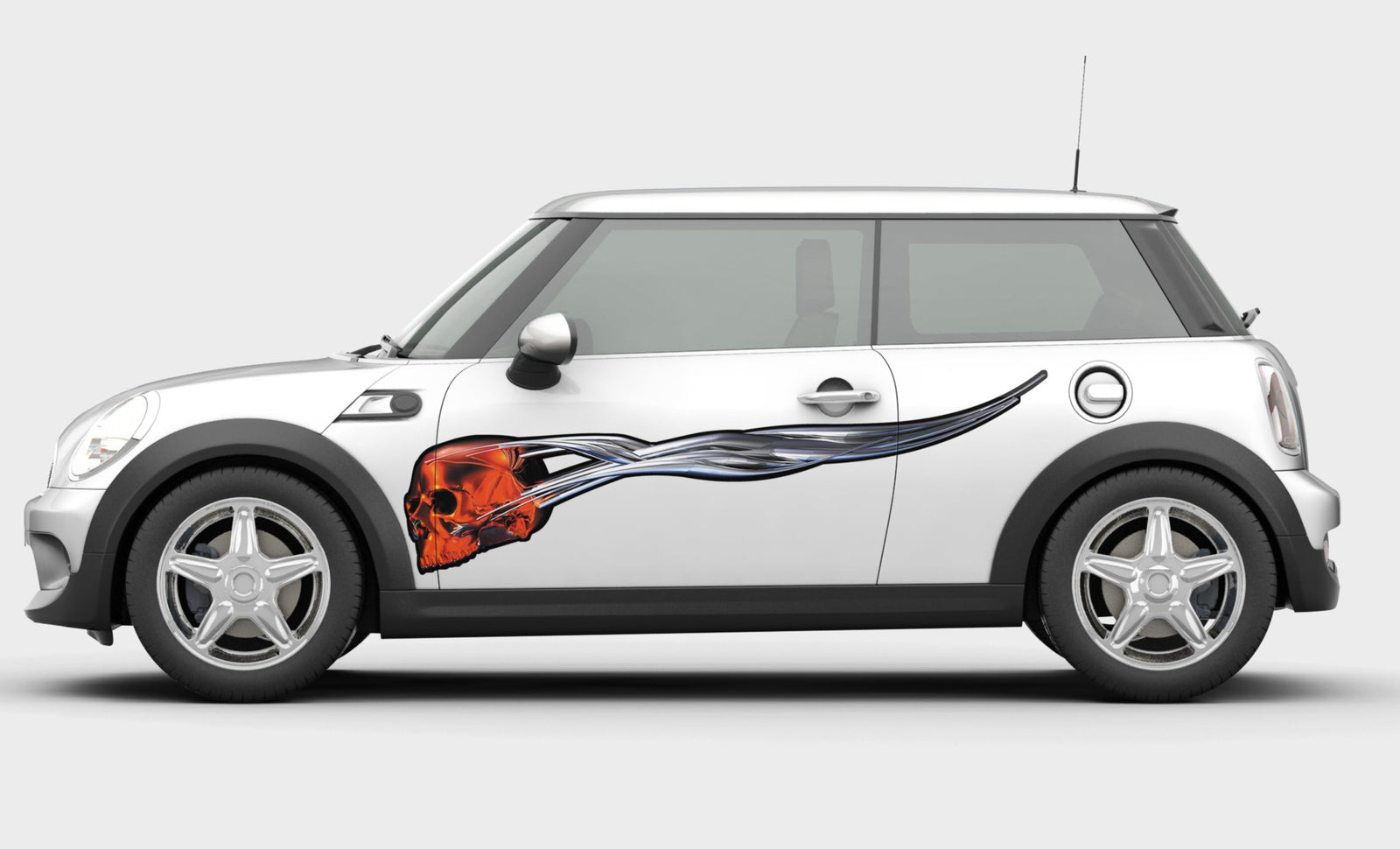 flying skull vinyl decal on the side of mini cooper car