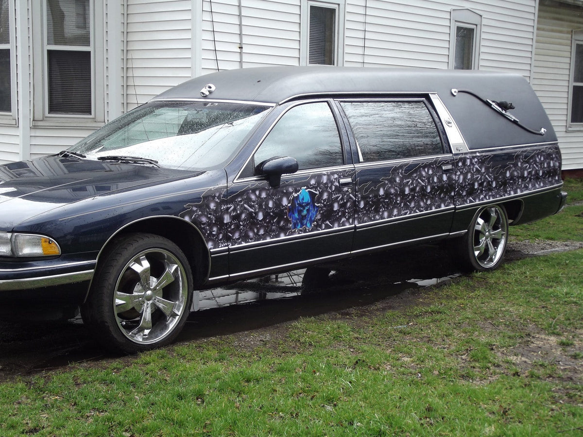 hearse station wagon with skulls flame half wrap on driver side