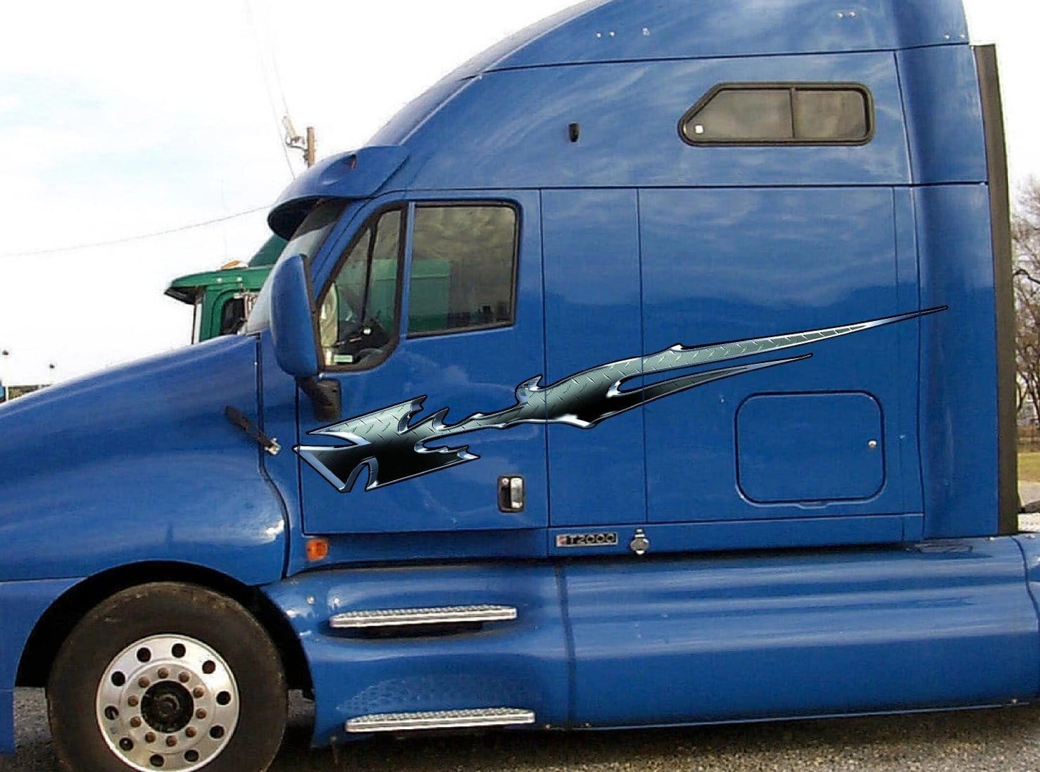 maltese cross vinyl graphics on blue semi truck