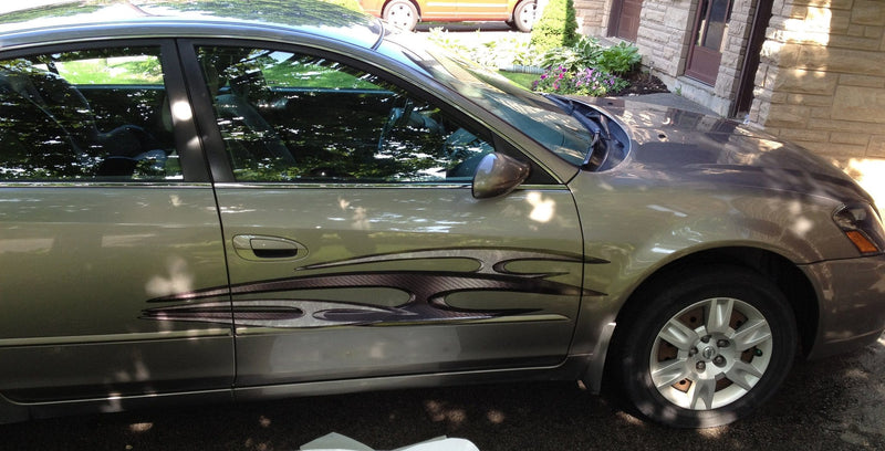 nissan altima sedan with tribal carbon spear on its passenger side