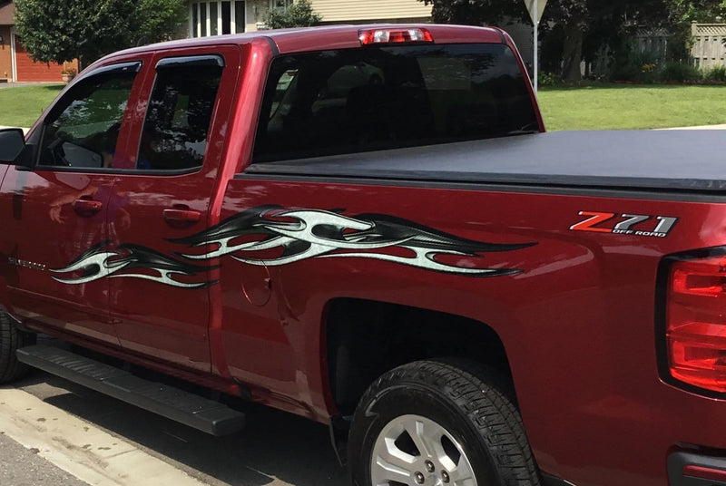 red silverado truck with gray tribal chains decal on driver side