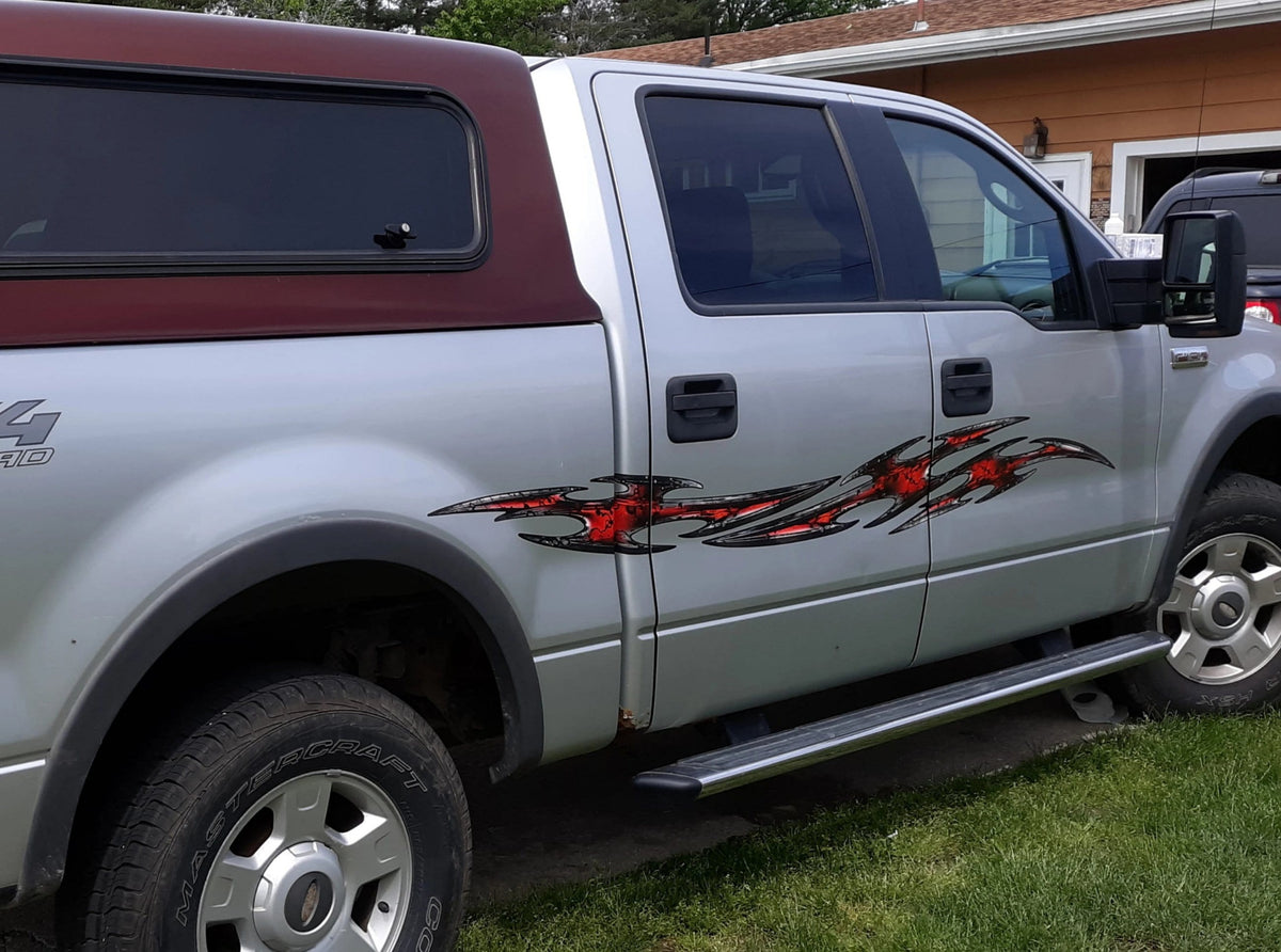 silver truck with tribal flares vinyl decal on passenger side
