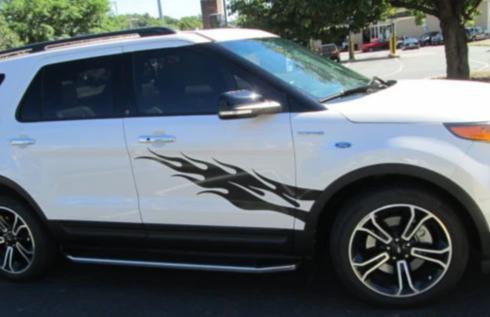 black flames vinyl graphics on white hatchback car