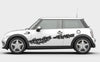 white mini cooper with checkered flag tears vinyl graphics on driver side
